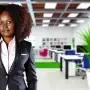 DALL·E-2024-07-11-08.51.52-A-professional-African-woman-in-her-30s-with-curly-hair-wearing-a-smart-business-suit-standing-confidently-in-a-modern-office-setting.-The-backgroun-90x90